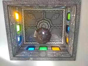 a picture of a window with stained glass at sidi kaouki ayt karoum in Sidi Kaouki