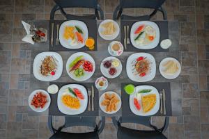 an overhead view of plates of food on a table at Hotel Deja Vu in Ksamil