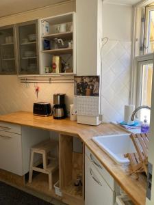 a kitchen with a counter with a laptop on it at Globetrotter Hotel in Copenhagen