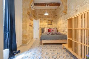 Voodi või voodid majutusasutuse 'Notabile' - Private Townhouse in Mdina toas