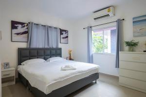 Katil atau katil-katil dalam bilik di 泰家帕山五卧室家庭别墅 +37 gambar