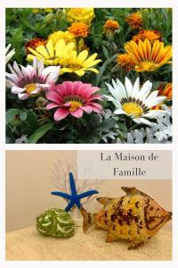 奧爾比亞的住宿－La Maison de Famille，两幅花画和一幅鱼画的拼贴画