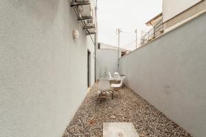 a corridor with a chair and a table in a building at Amazing Villa by Hosty in Porto +268 photos