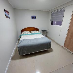 Un pat sau paturi într-o cameră la Cuentaconmigo la serena
