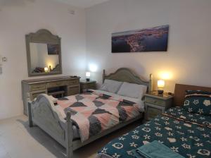 Кровать или кровати в номере Ta' Marija Home