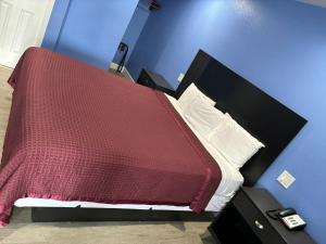 A bed or beds in a room at The Monterey Fireplace Inn