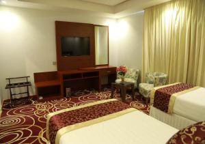 Postel nebo postele na pokoji v ubytování Wow Hotel Jeddah