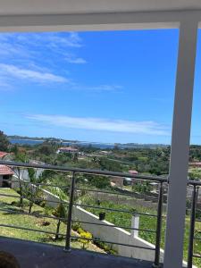 a view of the ocean from a balcony at Luxury 2-story retreat with private pool in Bilene beach in Macia