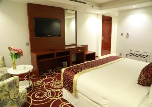 Postel nebo postele na pokoji v ubytování Wow Hotel Jeddah