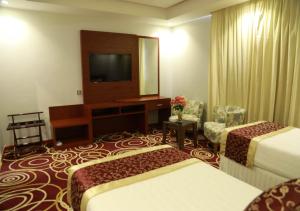 Postel nebo postele na pokoji v ubytování Wow Hotel Jeddah