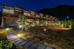 an image of a hotel at night at Isoaruki no Yuyado Ushiogumo -6 years or older- in Kawazu