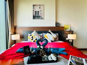 מיטה או מיטות בחדר ב-The Astra Condo Changkhlan in Chiang Mai