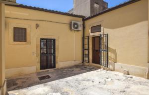 an empty building with two doors and a window at Nice Apartment In Noto With Wifi in Noto