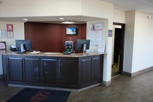 a lobby with a large counter in a hospital at Red Roof Inn Staunton in Staunton