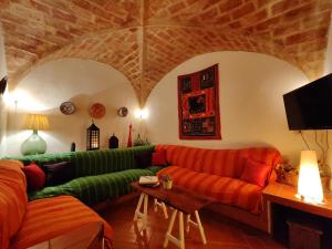 a living room with a couch and a table at Casa Castelló d'Empúries, 4 dormitorios, 8 personas - ES-228-96 in Castelló d'Empúries