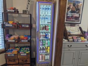 a refrigerator full of food and drinks in a room at Dutton Inn in Branson