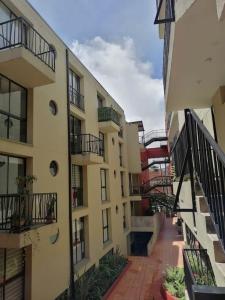a view of an apartment building with balconies at Apartamento en La Candelaria, centro histórico Bogotá in Bogotá