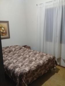 Ένα ή περισσότερα κρεβάτια σε δωμάτιο στο Casa Ampla