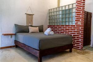Ein Bett oder Betten in einem Zimmer der Unterkunft Hotel Manava