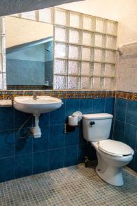 Ein Badezimmer in der Unterkunft Hotel Manava