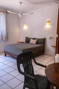 Ein Bett oder Betten in einem Zimmer der Unterkunft Hotel Manava