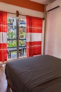 Ein Bett oder Betten in einem Zimmer der Unterkunft Hotel Manava