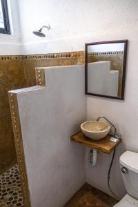 Ein Badezimmer in der Unterkunft Hotel Manava