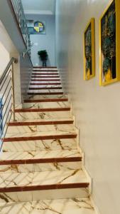 a set of stairs in a room with a stair case at Luxury Townhome in Oyarifa in Oyarifa