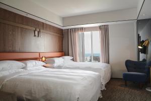 Postel nebo postele na pokoji v ubytování Sheraton Taitung Hotel
