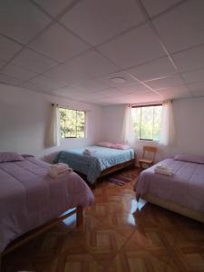 Ένα ή περισσότερα κρεβάτια σε δωμάτιο στο Casa familiar Rumichaca