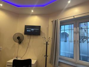 Televiisor ja/või meelelahutuskeskus majutusasutuses Modernes Apartment 1 und 2 in Dortmund Mitte