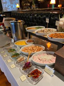 a buffet with many different types of food on a table at Hotel Silk Tree Nagoya in Nagoya