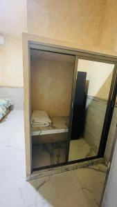 a glass window in a room with a bed inside at Puerto Xperiencias rooms in Acapulco