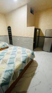 מיטה או מיטות בחדר ב-Puerto Xperiencias rooms
