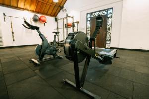 a gym with two exercise bikes in a room at S Resorts Hidden Valley Bali in Uluwatu +66 photos
