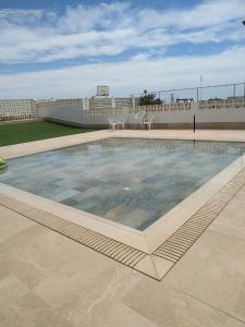 a swimming pool on the roof of a building at Desconexión y Relax in Mareny Blau