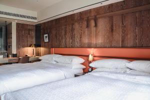 Postel nebo postele na pokoji v ubytování Sheraton Taitung Hotel