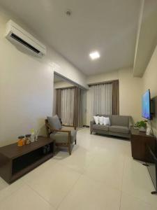 Area soggiorno di The Mactan Suite at The Mactan Newtown Resort