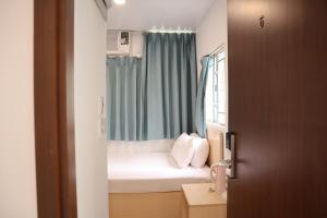 Posteľ alebo postele v izbe v ubytovaní Hoi To Hostel
