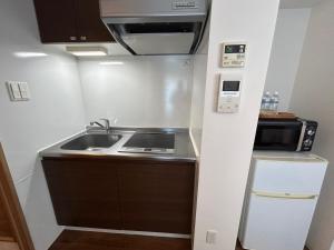 Eldhús eða eldhúskrókur á 湘南海岸 可见海景 江之岛旅游推荐住宿 独立房源 带卫生间、厨房 近海滩 海景房