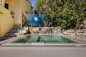 a swimming pool in the backyard of a house at Villa Edem in Kassiopi