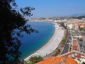 a view of a beach and the ocean at Le Fontana in Nice