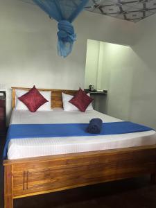 Postel nebo postele na pokoji v ubytování Himansa Homestay