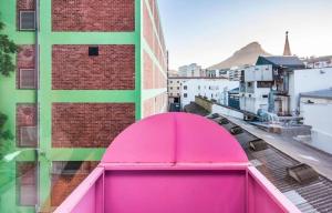 a pink roof on top of a building at Uxolo Cape Town Living in Cape Town