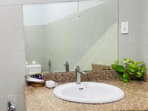 a bathroom counter with a sink and a mirror at Lyly Hotel - Pham Ngu Lao in Ho Chi Minh City