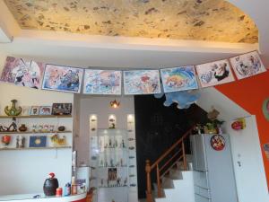 a kitchen with a ceiling with paintings on it at No.1 Shelter in Toucheng