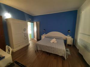 Postel nebo postele na pokoji v ubytování Borgo Rurale Cares