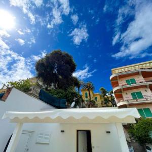 a building with a blue sky in the background at Marco House - Seaview Apartment - Anzio in Anzio