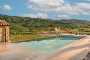 a swimming pool with a view of a mountain at B&B Panfilo Farmhouse in Cellino Attanasio