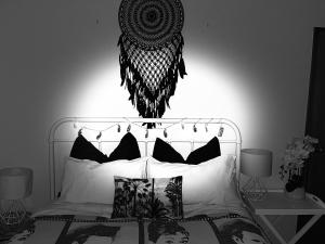 a black and white photo of a bedroom with a bed at Breakfast at Tiffanys in Queenstown